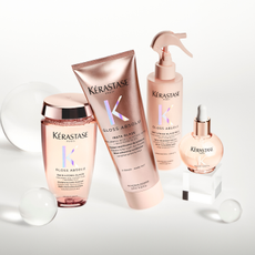 Kerastase Gloss Absolu products on clear/grey background.