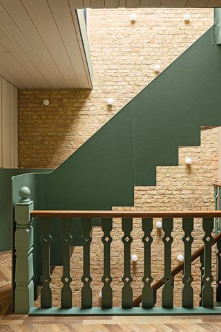 green staircase in suburban House by SPPARC