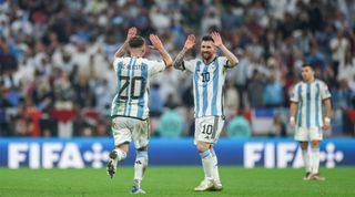 Lionel Messi of Argentina celebrates with teammate Alexis Mac Allister after scoring his team's third goal during the FIFA World Cup 2022 final between Argentina and France on 18 December, 2022 at the Lusail Iconic Stadium in Lusail, Qatar.
