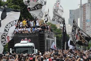 Corinthians players celebrate with their fans following their Club World Cup win in 2012.