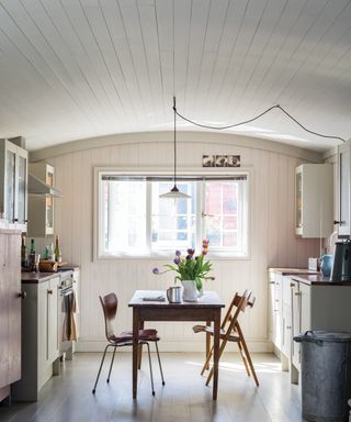 A white kitchen by Farrow & Ball with shiplap on walls and ceiling