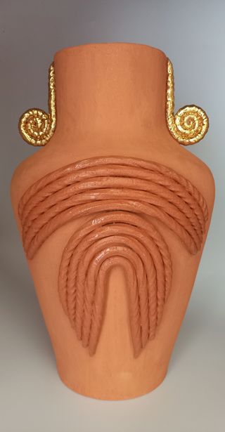 Terracotta vase with textured and gold details