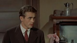 James Dean in a brown jacket and tie in East Of Eden