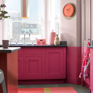 kitchen room with pink kitchen cabinets