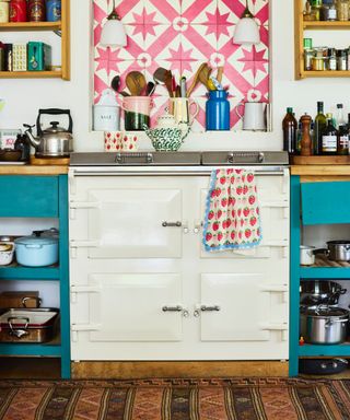 Easy upgrades for small kitchen, pink and turquoise kitchen farmhouse style, freestanding units, pink hand pained tiles above Aga
