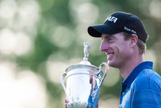 Jim Furyk holds the US Open trophy in 2003