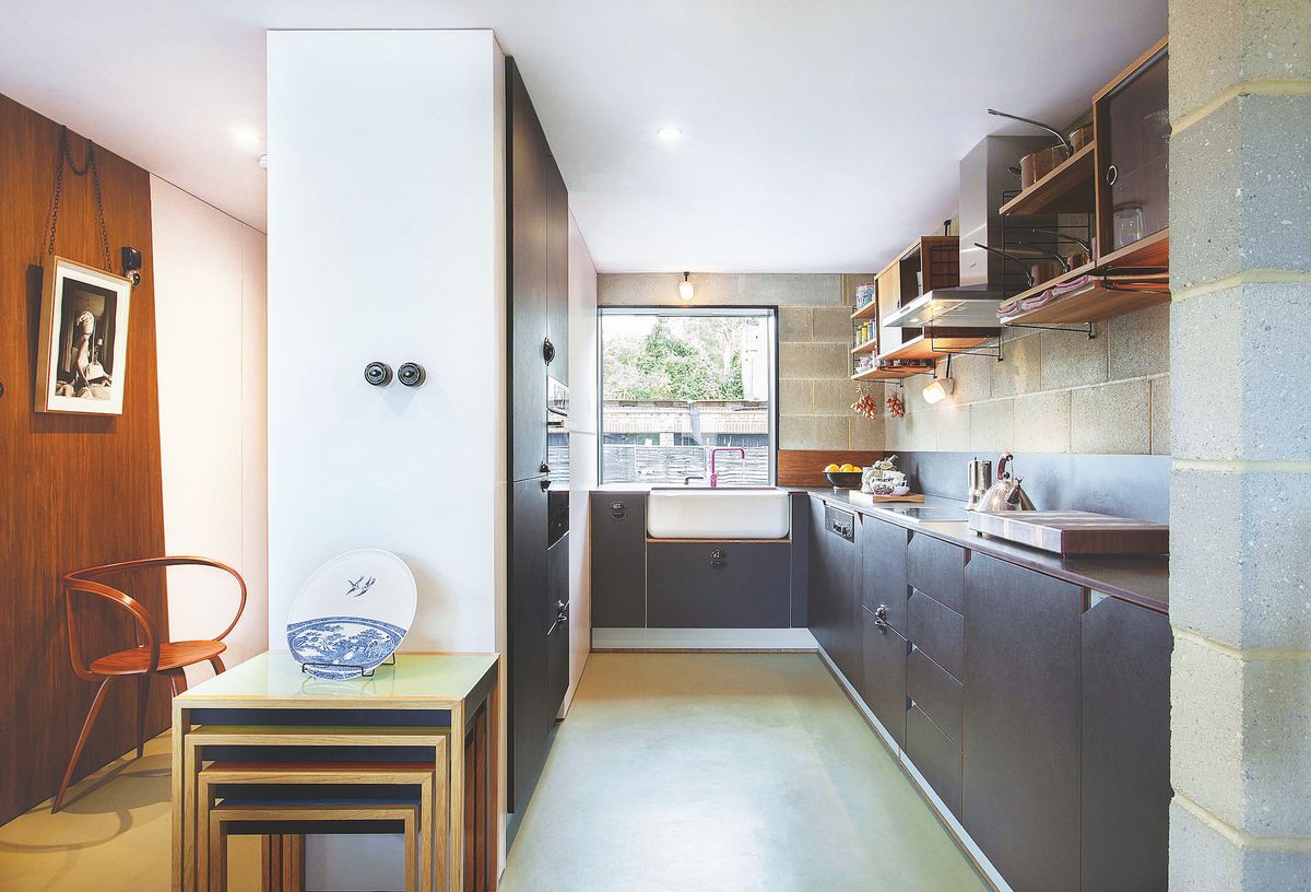 small blue plywood kitchen with belfast sink