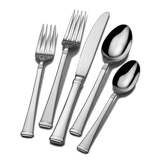 Two silver forms, one knife, and two spoons on a white background