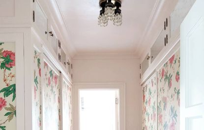 DIY mirrored closet uppers and floral wallpaper