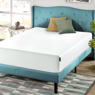 Beat cheap mattress on green bed frame
