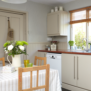 kitchen with dining area and venetian blind