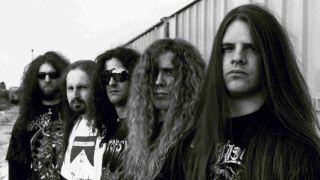 Cannibal Corpse posing for photographs in an industrial estate in 1996