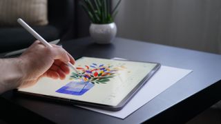 image of person using best iPad for drawing at home