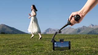 DJI Osmo Mobile 8 pointing at young woman