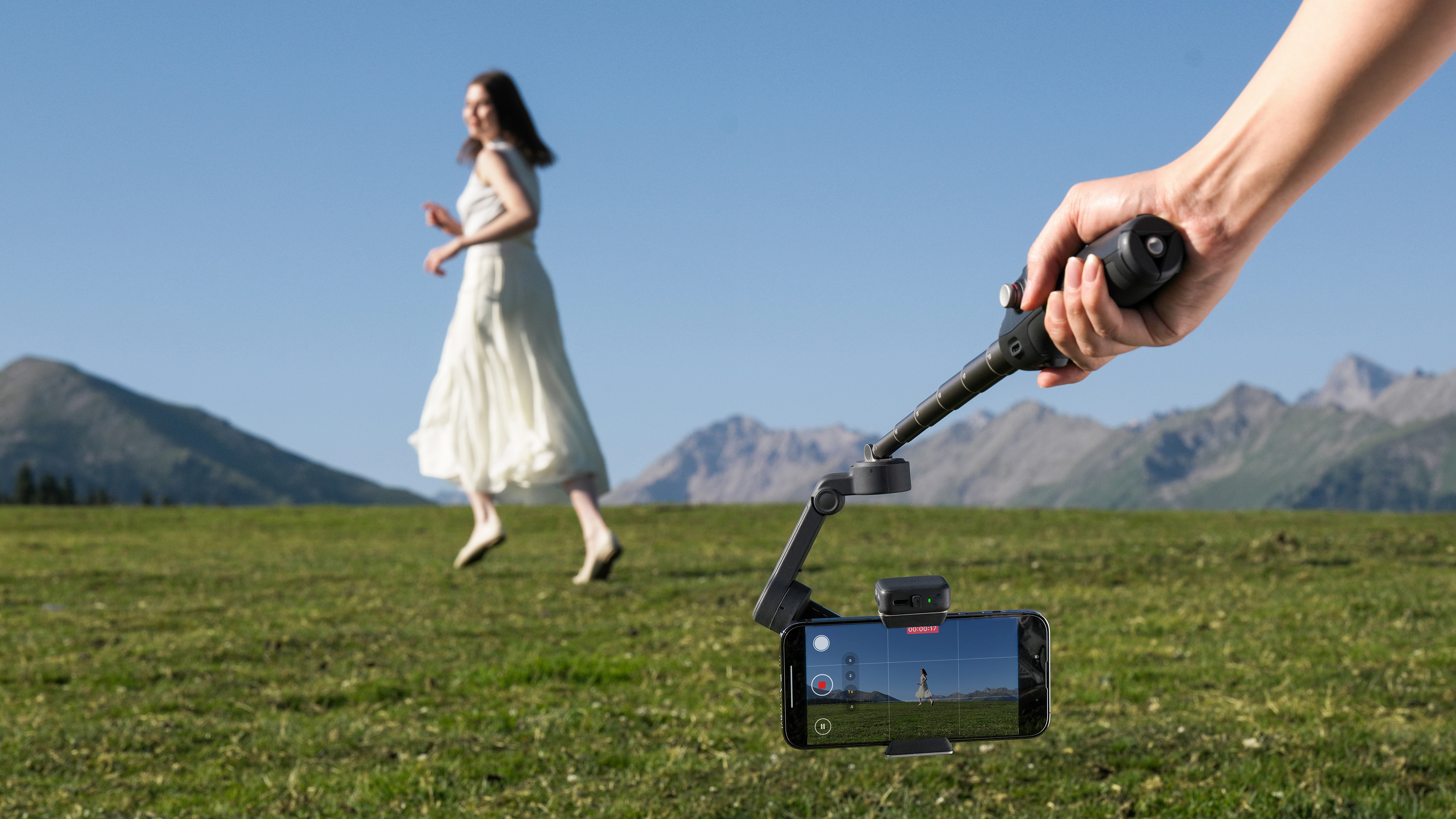 DJI Osmo Mobile 8 pointing at young woman