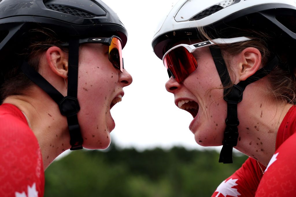 GLENTRESS FOREST PEEBLES SCOTLAND AUGUST 10 LR Second ranked Marin Lowe of Canada and race winner Isabella Holmgren of Canada react after the Women Junior Crosscountry Olympic at the 96th UCI Cycling World Championships Glasgow 2023 Day 8 UCIWT on August 10 2023 in Glentress Forest Peebles Scotland Photo by Dean MouhtaropoulosGetty Images