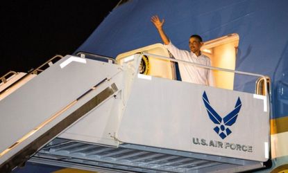 Obama boards Air Force One in Honolulu. He arrived in Washington earlier than expected this week to attend to the fiscal cliff crisis.