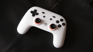 Google Stadia controller resting on a black surface