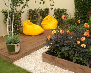 timber decking with yellow bean bags