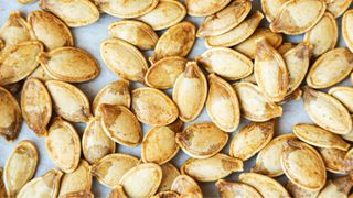 Roasted pumpkin seeds on a tray