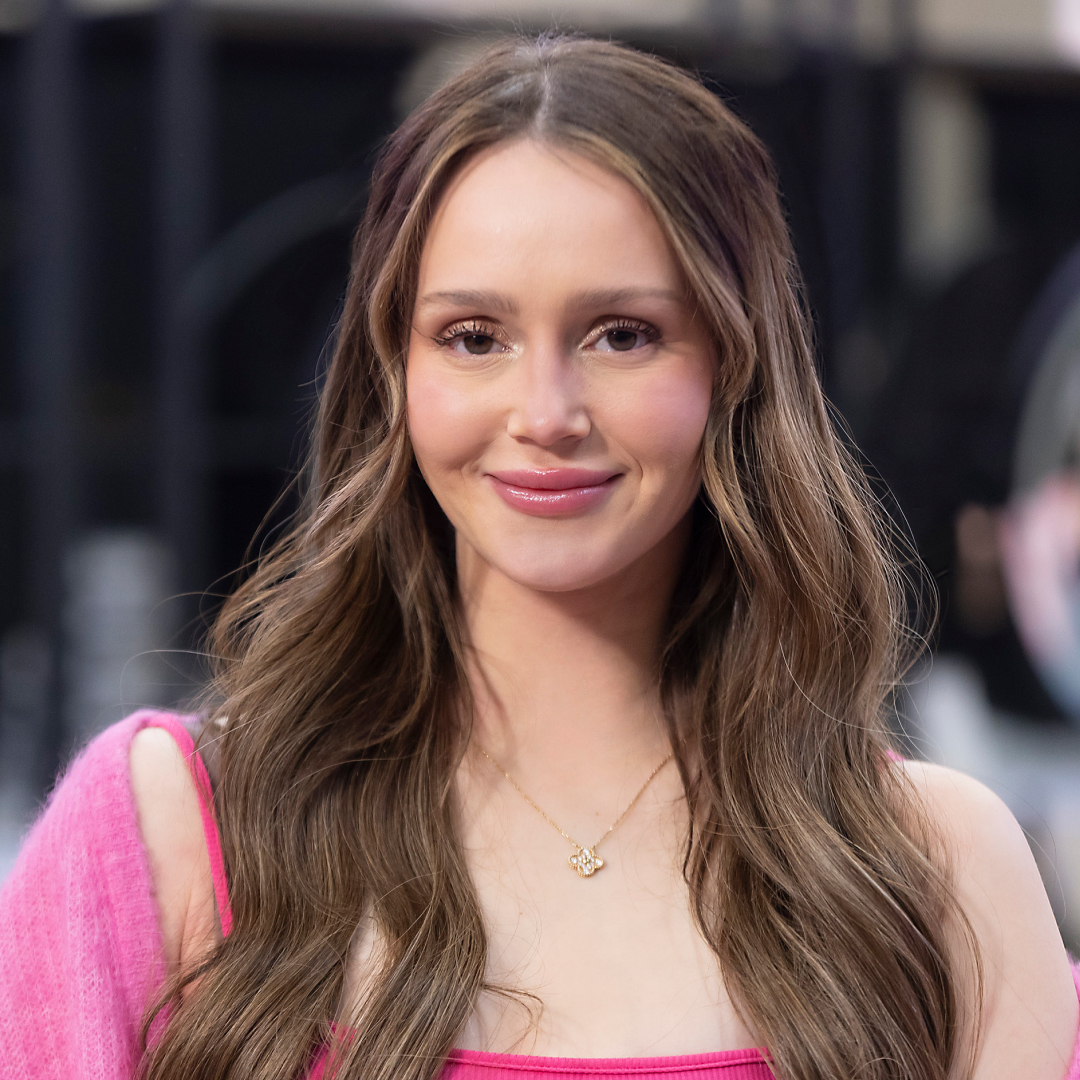 MIKAYLA MATTHEWS poses in a pink sweater in a promo shot for the secret lives of mormon wives