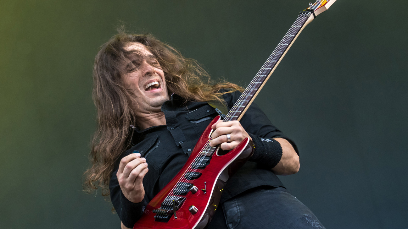 A picture of Kiko Loureiro on stage with Megadeth