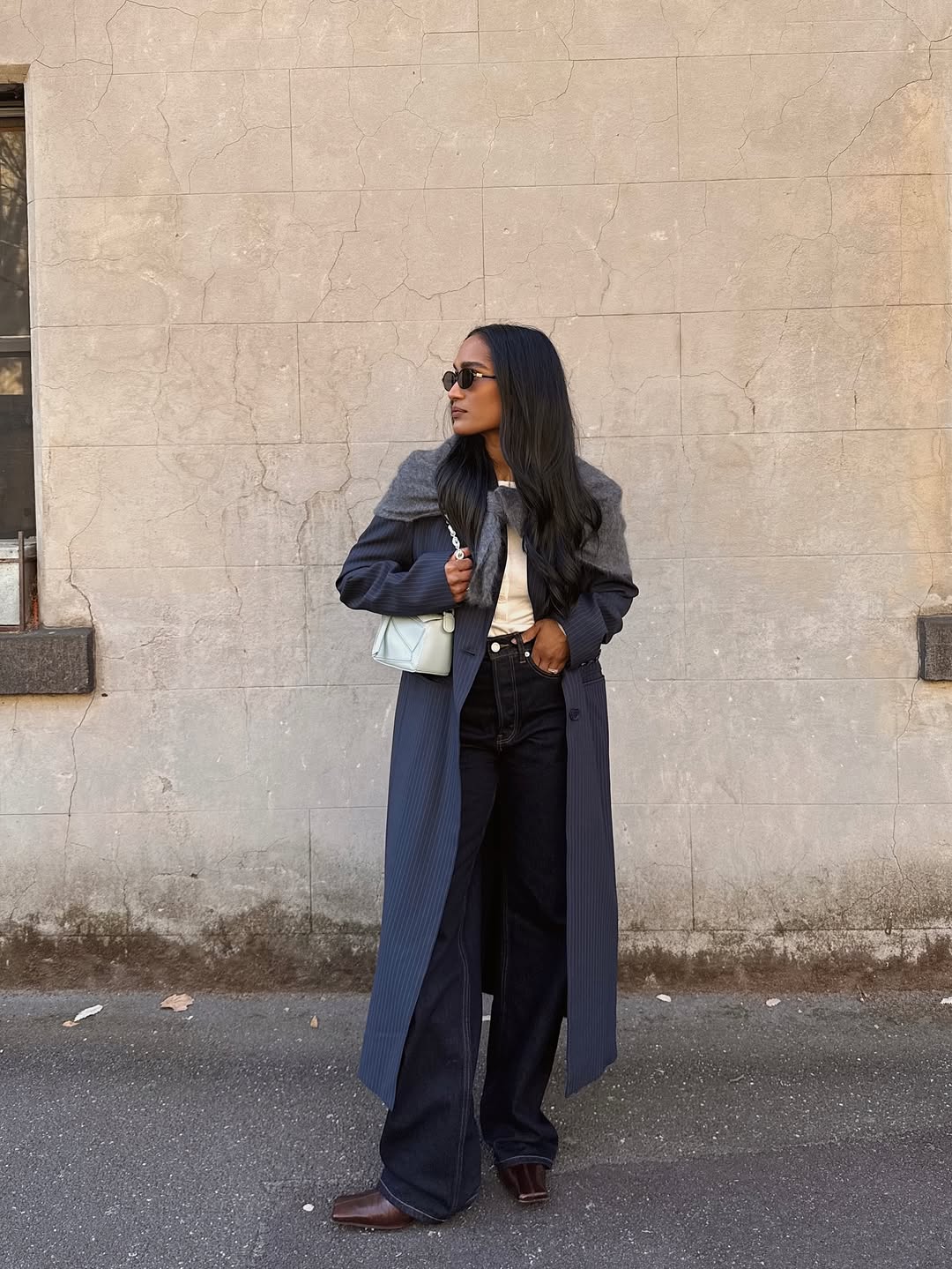 Div wearing navy coat