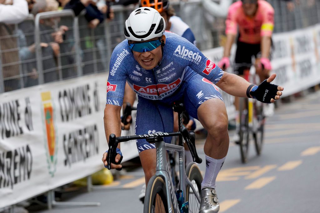 Jasper Philipsen celebrates his victory at Milano-Sanremo