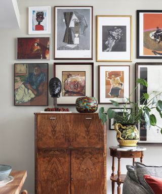 Art wall and plants in Sophie Ashby' London apartment