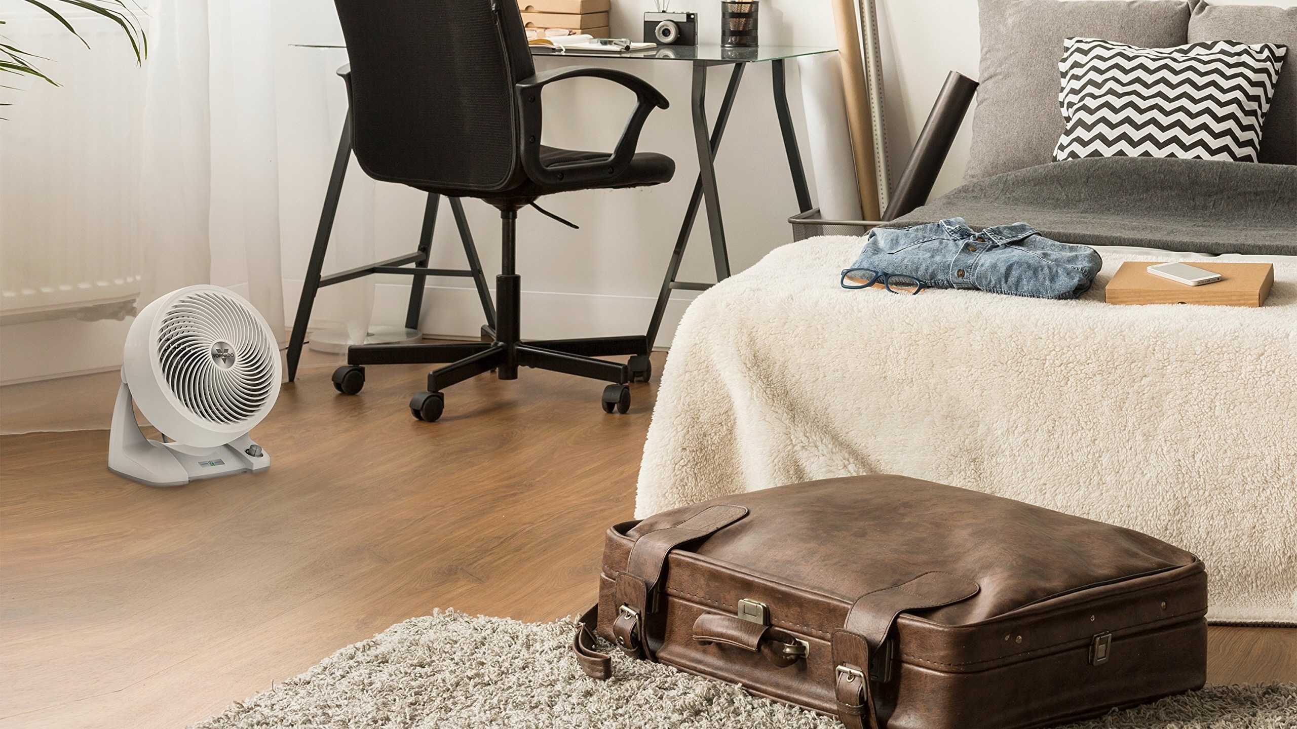 A Vornado 633DC fan on the floor of a bedroom
