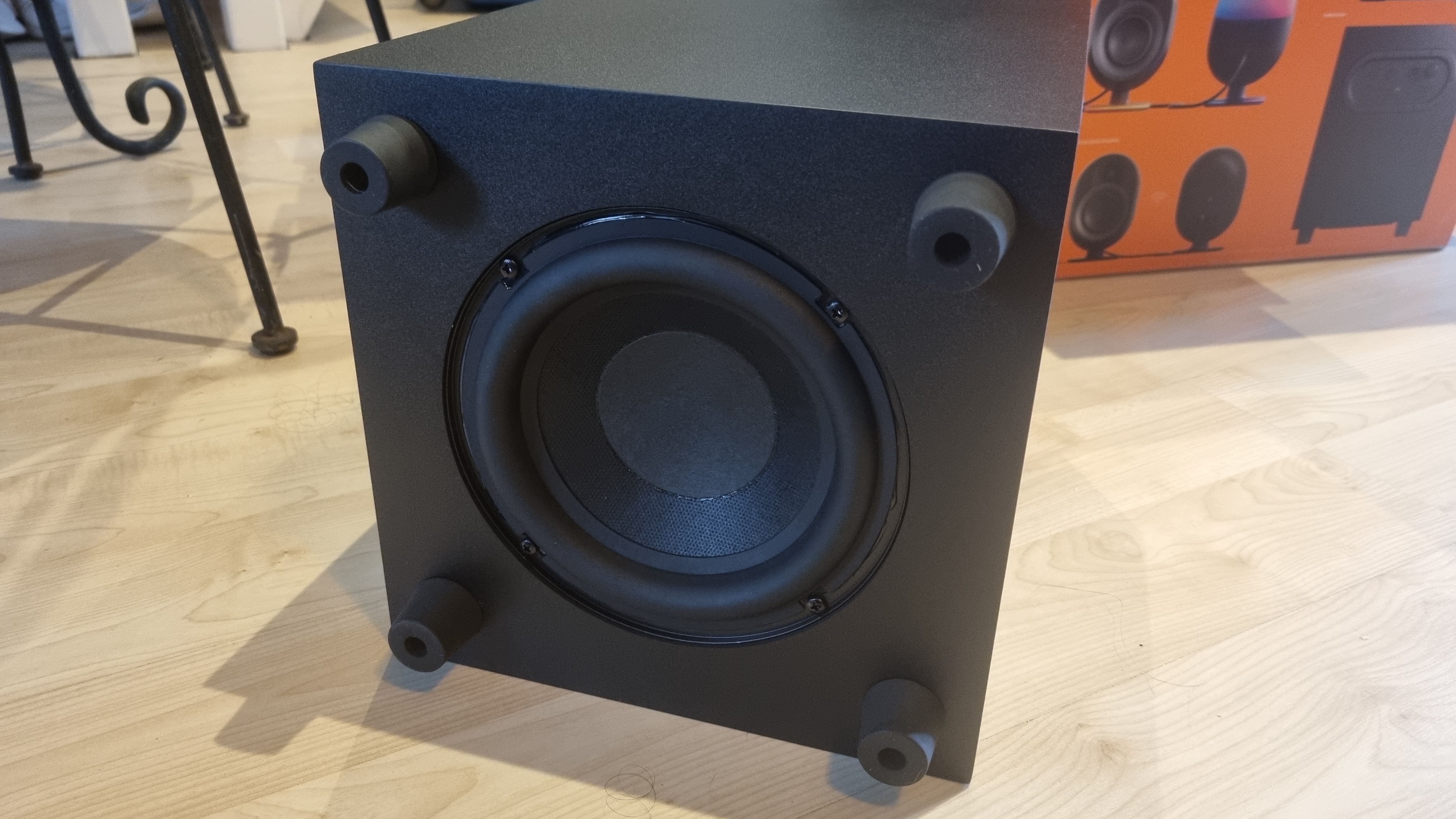 The underside of the subwoofer of the SteelSeries Arena 9 5.1 speakers, showing the large 6.5 inch driver