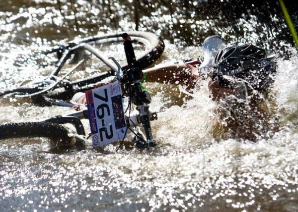 A bike and rider take an unplanned dip at the Cape Pioneer Trek