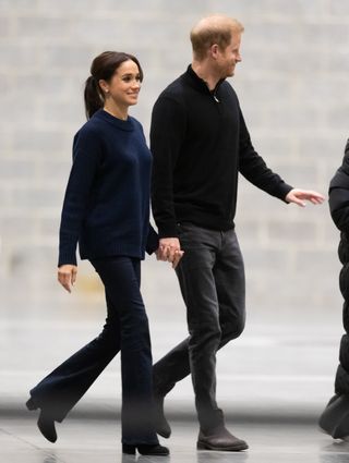 An image of Meghan Markle wearing flared jeans.