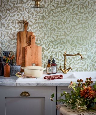 Country kitchen with floral wallpaper backsplash