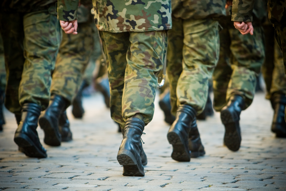 Why are soldiers often told not to march in unison over a bridge