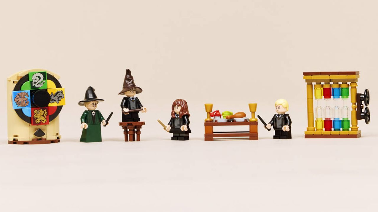 Wizard and witch minifigures spread out across a pink environment, full of accessories