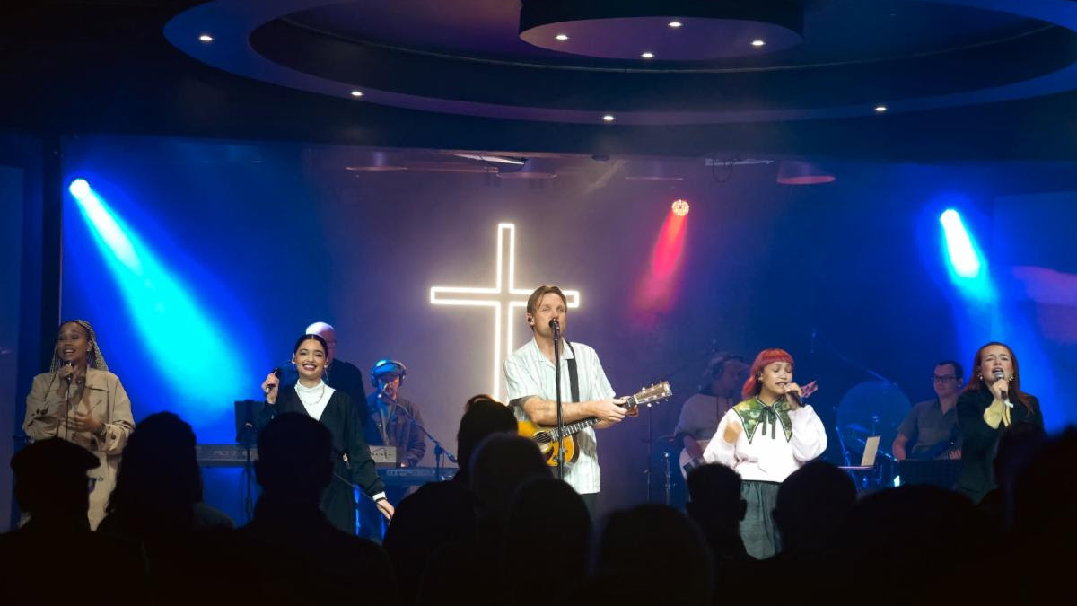 A church band playing on a stage.