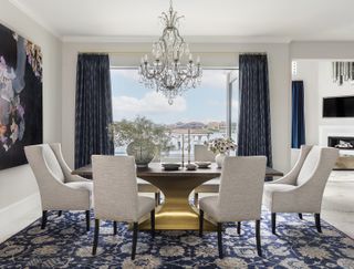 dining room with gray walls and blue curtains