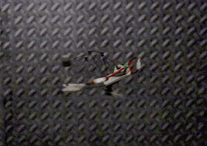 A gif of a drone spinning against a metal background