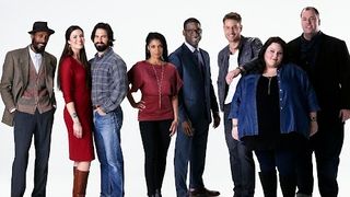 This Is Us cast standing in a row against a white background