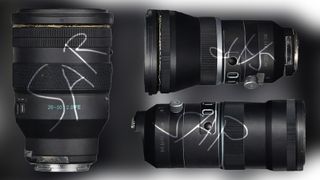A trio of black camera lenses.