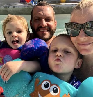 Michelle Hynek and family take a selfie in the sea during a day at the beach.