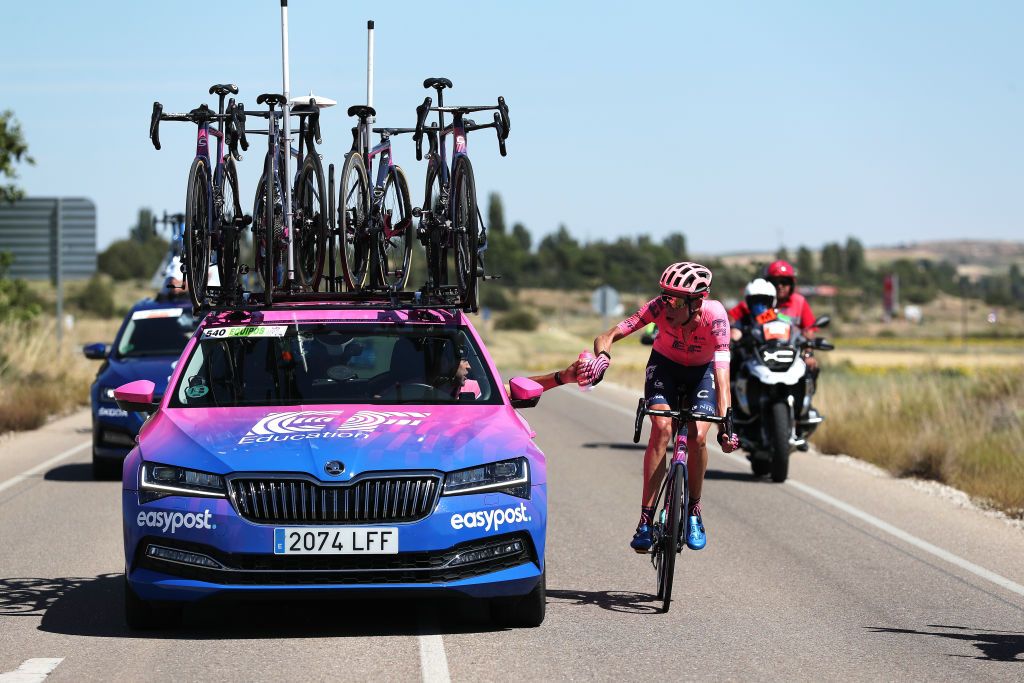 ARANDA DE DUERO SPAIN AUGUST 06 Hugh Carthy of United Kingdom and Team EF Education Nippo picks bottles from Team car in the Breakaway during the 43rd Vuelta a Burgos 2021 Stage 4 a 149km stage from Roa to Aranda de Duero VueltaBurgos BurgosCycling CapitalMundialdelCiclismo on August 06 2021 in Aranda de Duero Spain Photo by Gonzalo Arroyo MorenoGetty Images