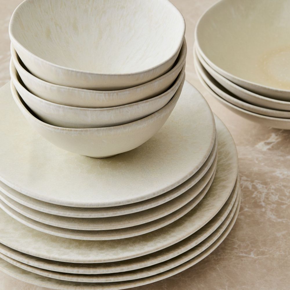 Stack of off-white plates and bowls