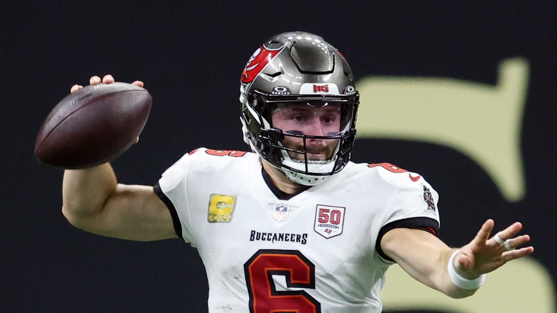 Tampa Bay Buccaneers quarterback Baker Mayfield shaping to throw the ball in an NFL game