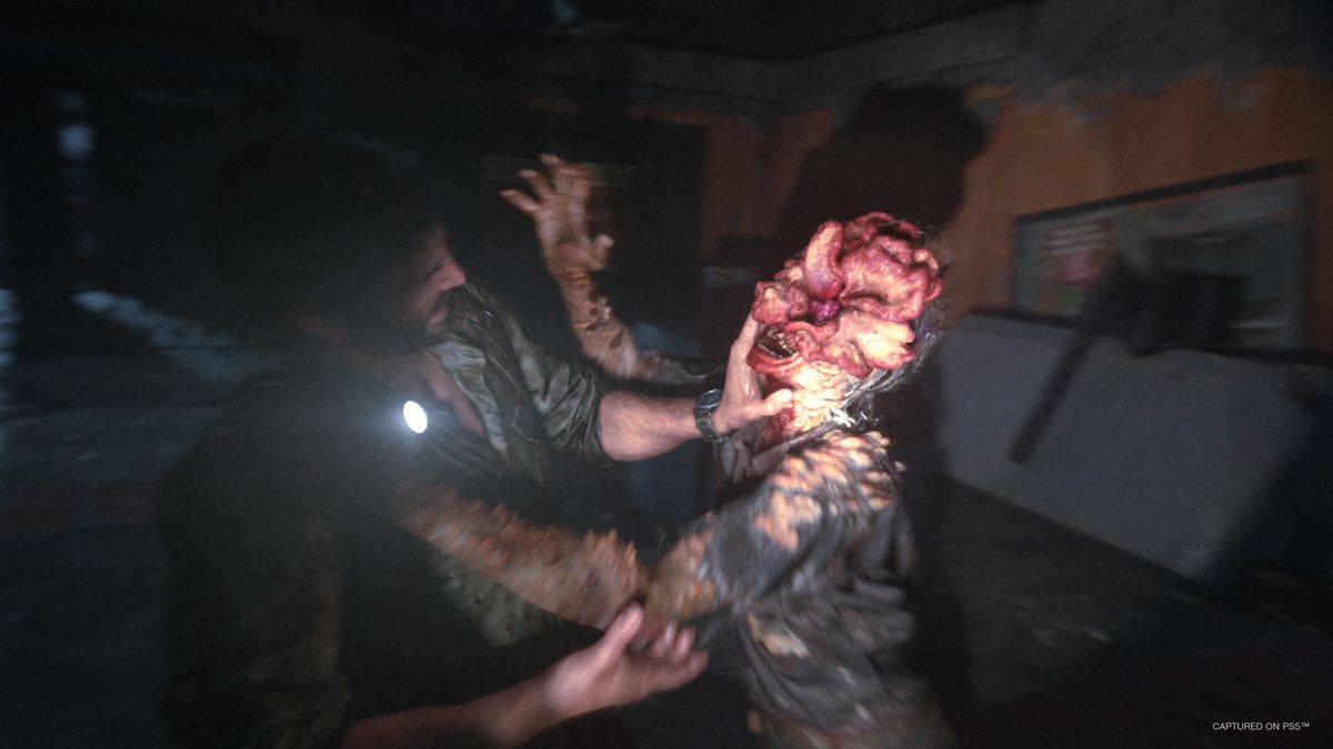 The Last of Us Part 1 Clicker grabbing Joel