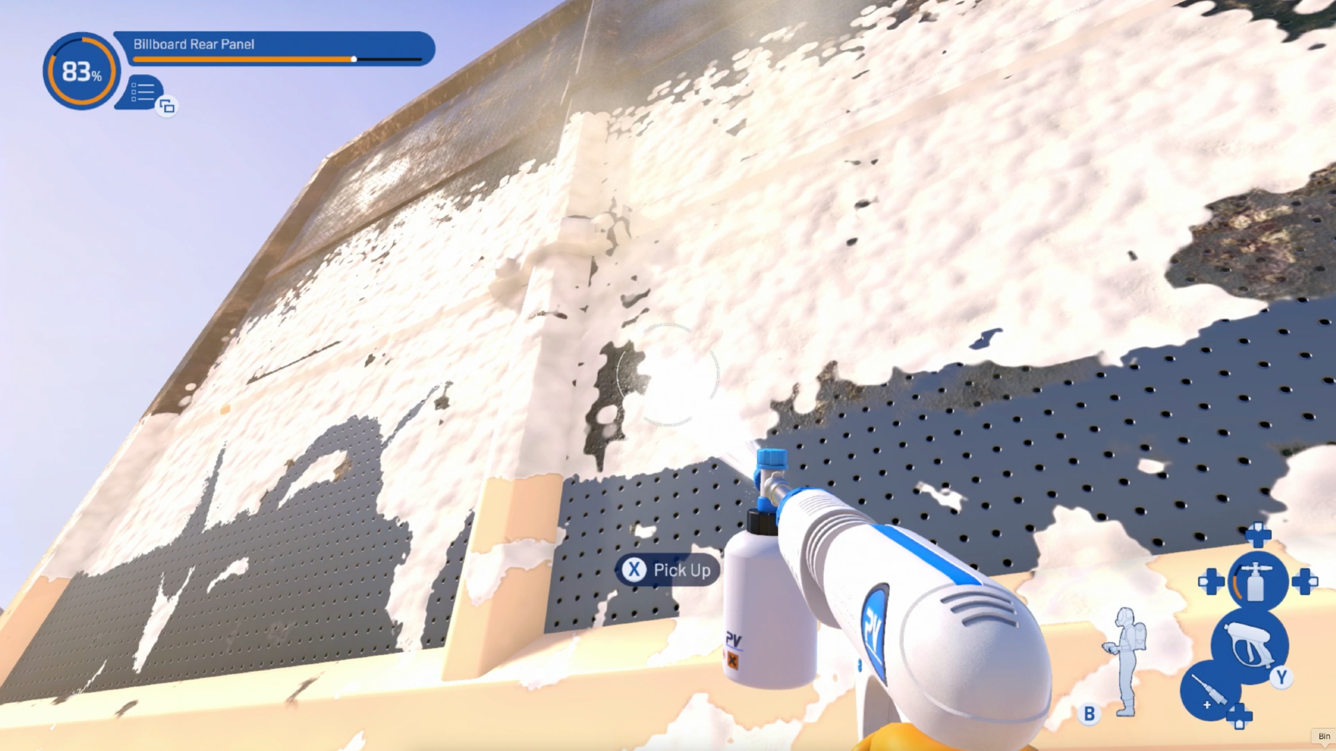 A billboard covered in soap and being blasted away with a powerwasher in PowerWash Simulator 2