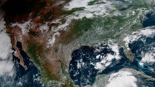 The shadow of the moon blots out the Pacific Northwest in this GOES-16 geocolor image of the 2017 Solar Eclipse.