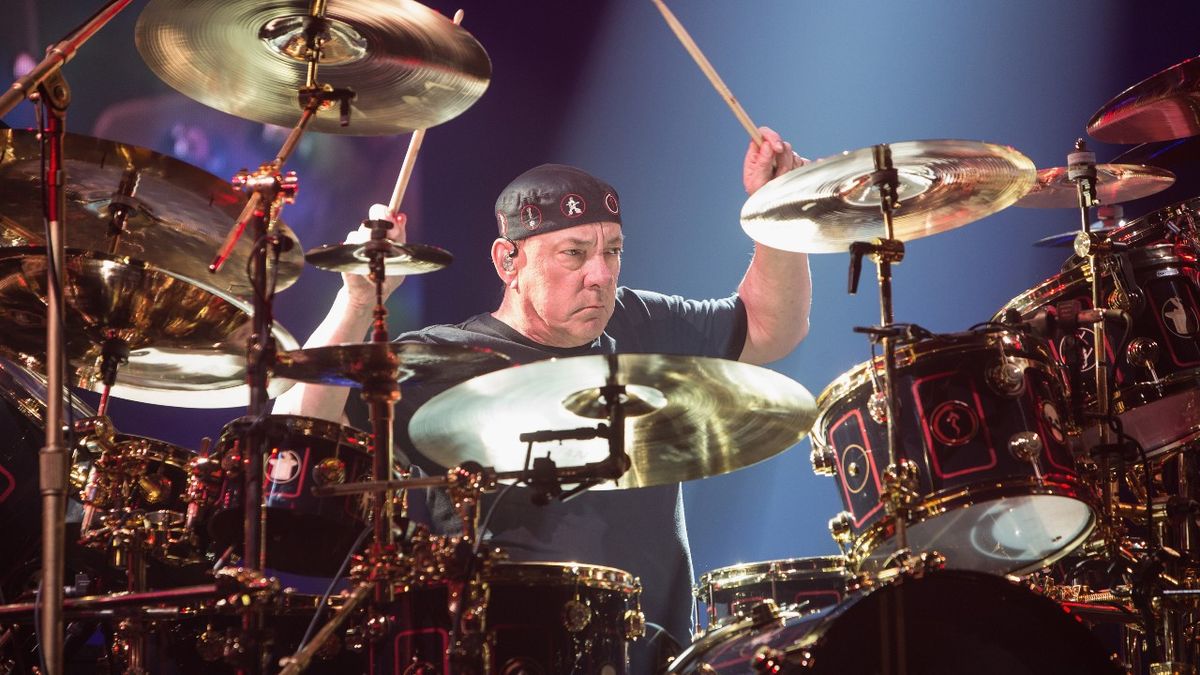 Neil Peart of Rush performs on stage during the R40 LIVE Tour at KeyArena on July 19, 2015 in Seattle, Washington