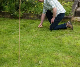 Marking out an area of lawn with string